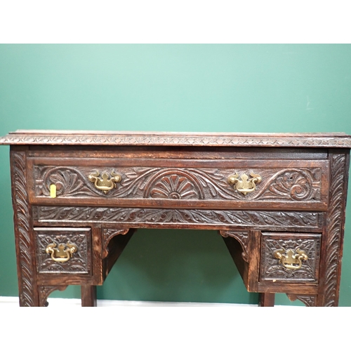 306 - A 19th Century oak Lowboy fitted three drawers with carved design on square cut supports 2ft 6in W x... 