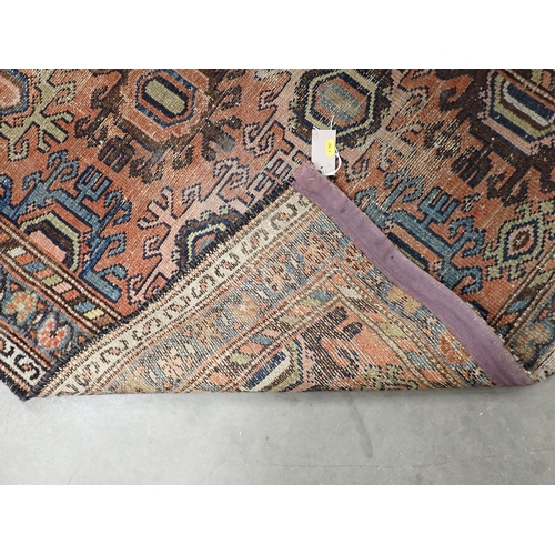 324 - A bordered Persian Rug with coloured medallions on a red ground, 5ft 11in x 3ft 3in, and a small Run... 