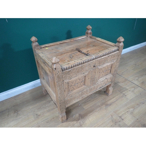 326 - An antique Eastern pine Chest with hinged lid above carved two panel front on square cut supports 2f... 