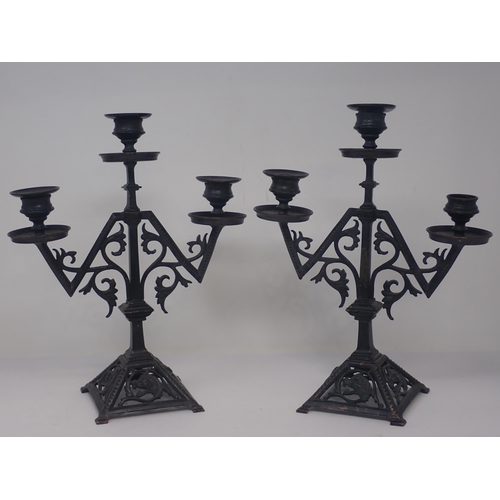 330 - A pair of cast metal Arts and Craft influenced three branch Candelabra 11in H