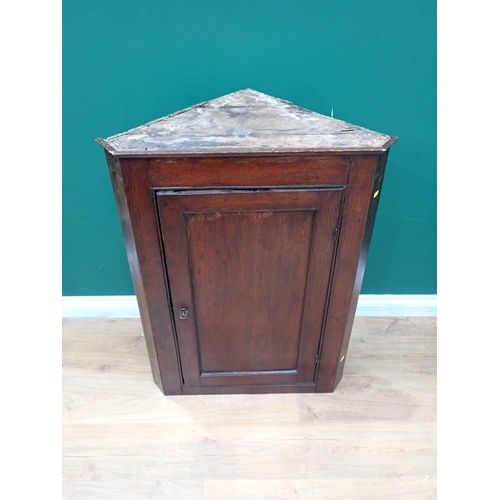 334 - An antique oak hanging Corner Cupboard 3ft 2in H x 2ft 4in W