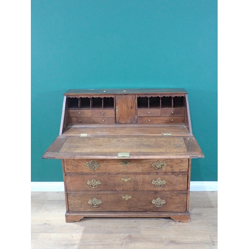 361 - An antique oak Bureau, the sloping front enclosing a fitted interior above four long drawers, 3ft W