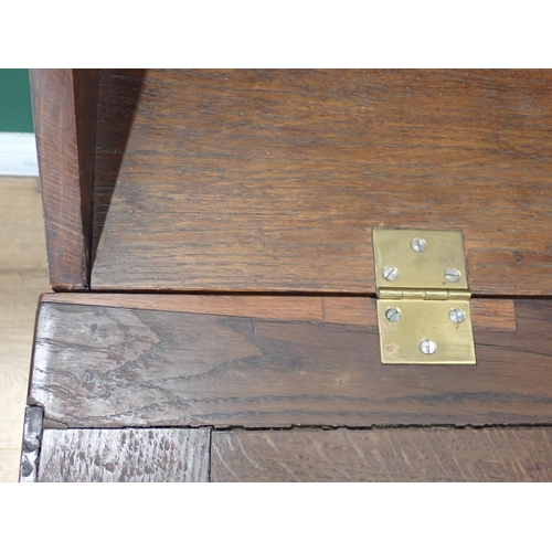 361 - An antique oak Bureau, the sloping front enclosing a fitted interior above four long drawers, 3ft W