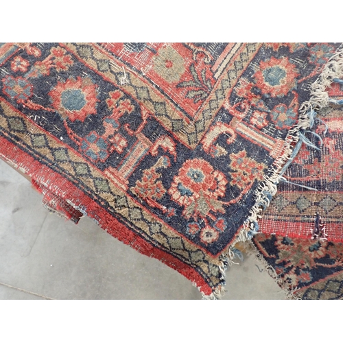 370 - A bordered Persian Rug with floral designs on a red ground, worn, 6ft 3in and a small Persian Rug, w... 