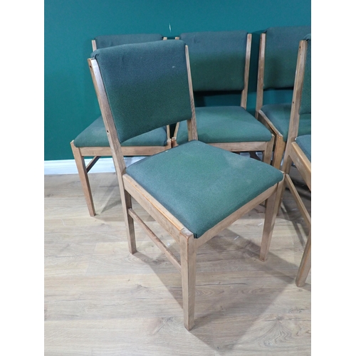 381 - A set of six Gordon Russell Dining Chairs with green upholstery and bearing labels