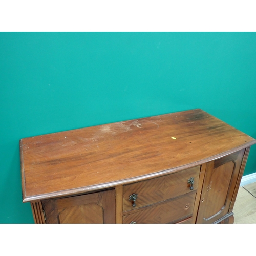 387 - A mahogany veneered bow fronted Sideboard fitted pair of fielded cupboard doors flanking three drawe... 