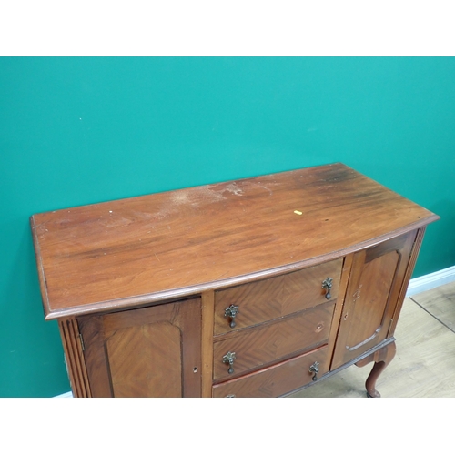 387 - A mahogany veneered bow fronted Sideboard fitted pair of fielded cupboard doors flanking three drawe... 