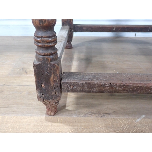 405 - A 17th Century oak  Side Table with moulded two plank lid on bobbin turned supports united by surrou... 