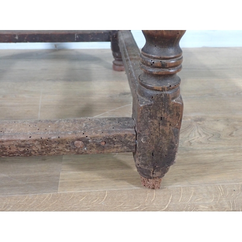 405 - A 17th Century oak  Side Table with moulded two plank lid on bobbin turned supports united by surrou... 