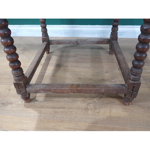 405 - A 17th Century oak  Side Table with moulded two plank lid on bobbin turned supports united by surrou... 