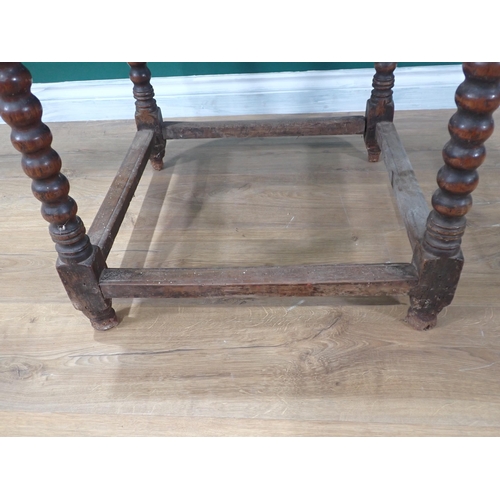 405 - A 17th Century oak  Side Table with moulded two plank lid on bobbin turned supports united by surrou... 