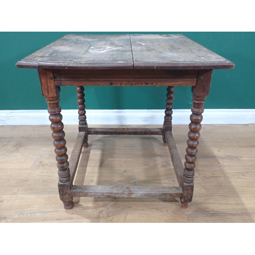 405 - A 17th Century oak  Side Table with moulded two plank lid on bobbin turned supports united by surrou... 