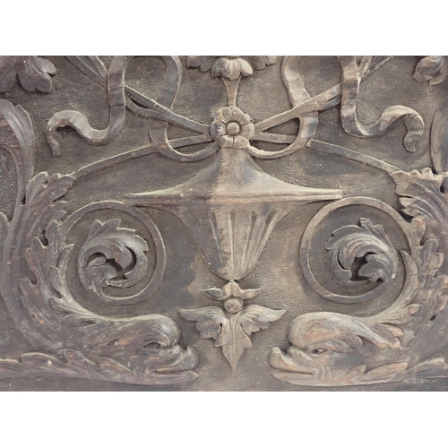 416 - An 18th Century carved oak Panel of Urn, flowers and dolphins 1ft 2in W x 1ft H