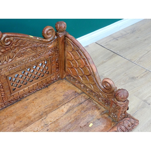 417 - An Eastern carved hardwood swinging Bench 4ft 8in W x 1ft 8in H