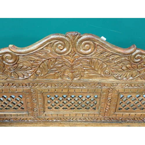 417 - An Eastern carved hardwood swinging Bench 4ft 8in W x 1ft 8in H