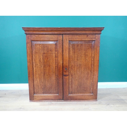 448 - An 18th Century and later oak Cupboard fitted pair of fielded doors enclosing shelves 3ft 2in W x 3f... 