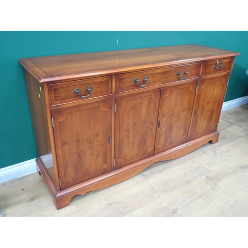 452 - A reproduction yew veneered Sideboard fitted three frieze drawers above four cupboard doors 5ft W x ... 