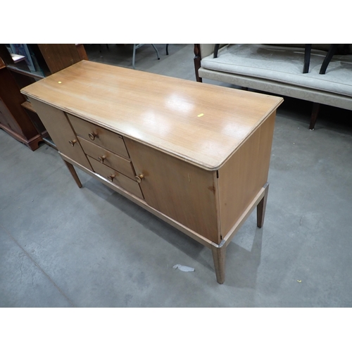 455 - A Gordon Russell teak Sideboard fitted pair of cupboard doors flanking three drawers 4ft 8in W x 2ft... 