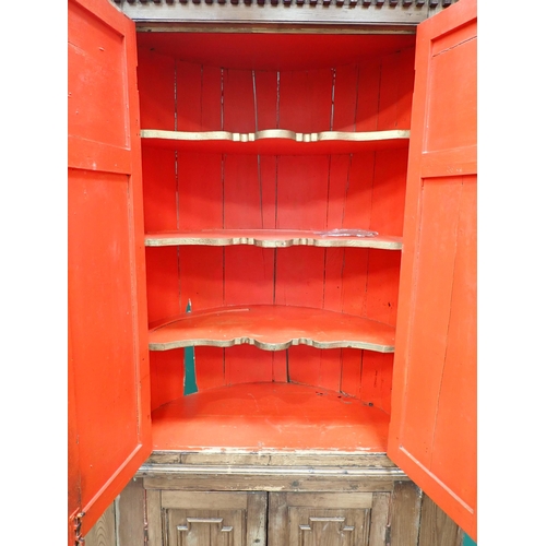 47 - A 19th Century pine barrel back Corner Cupboard fitted two pairs of moulded panelled doors 6ft 8in H... 