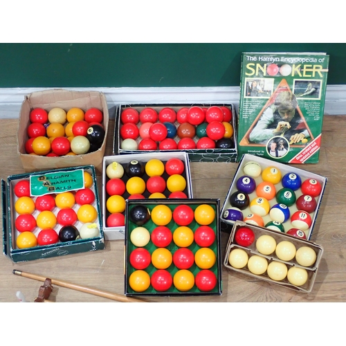 484 - A quantity of Snooker and Pool Balls, a Snooker Encyclopedia, Cues and Rests