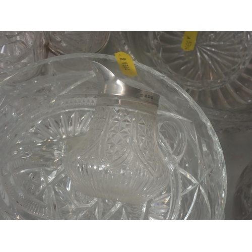 490 - A quantity of Glassware including plated Cruet Set, Decanters, Bowls, silver mounted Jug etc