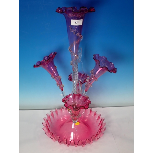 524 - A Victorian cranberry glass Epergne, with three flutes and two baskets, 1ft 11in H