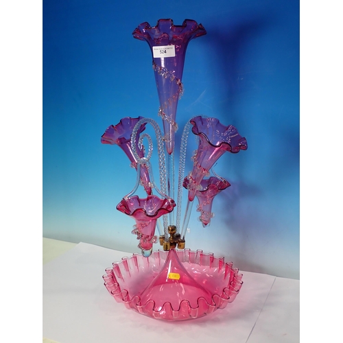 524 - A Victorian cranberry glass Epergne, with three flutes and two baskets, 1ft 11in H