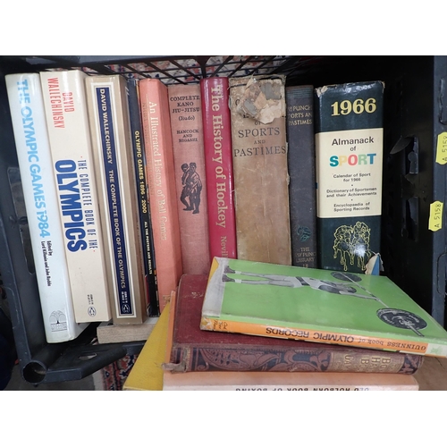 553 - Four boxes of Books including Olympics, Hockey, Equestrian, etc. and a box of Rosettes