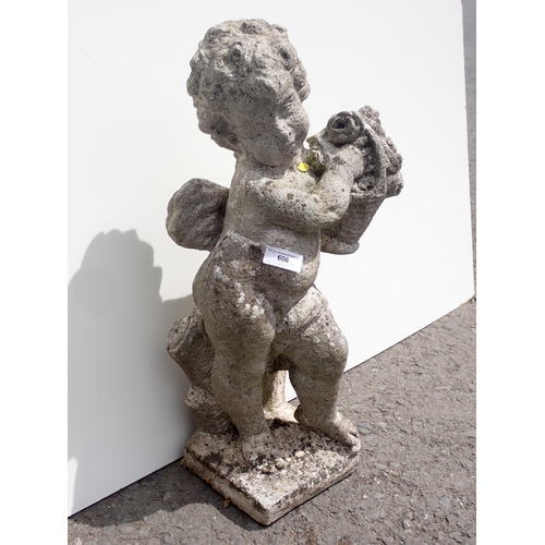 606 - A concrete garden Statue of a boy with basket 2ft H