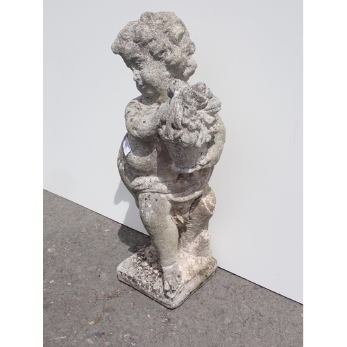 606 - A concrete garden Statue of a boy with basket 2ft H