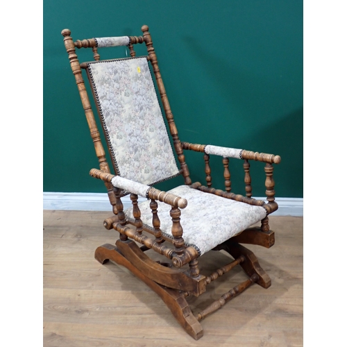 651 - An upholstered American style Rocking chair