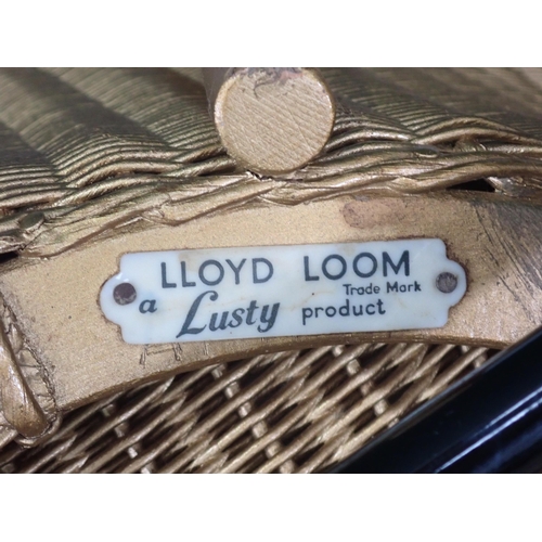 656 - A Lloyd Loom Lusty Chair with metal base