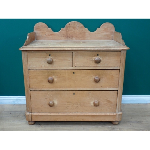 668 - A Victorian pine Chest with shaped raised back fitted two short and two long drawers mounted on bun ... 