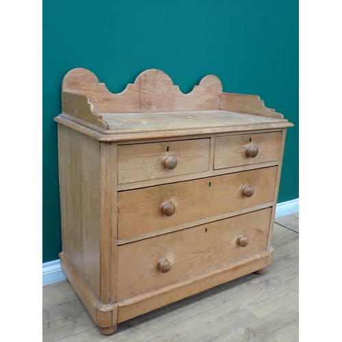 668 - A Victorian pine Chest with shaped raised back fitted two short and two long drawers mounted on bun ... 