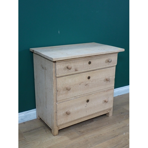 678 - A small pine Chest of three long drawers on squared supports, 2ft 6in W