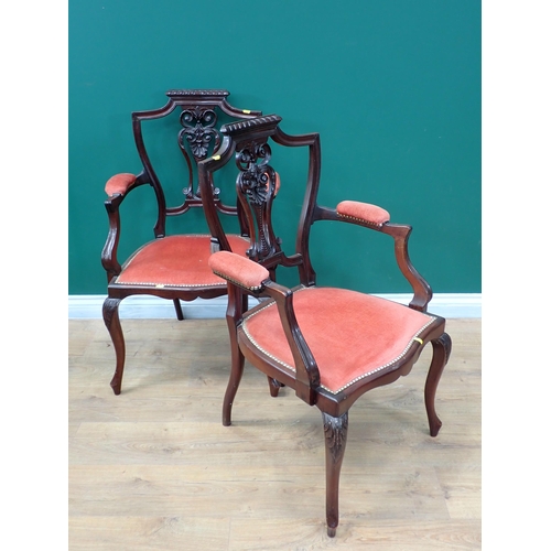 687 - A pair of Edwardian Elbow Chairs with pierced splat backs