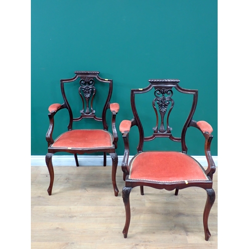 687 - A pair of Edwardian Elbow Chairs with pierced splat backs