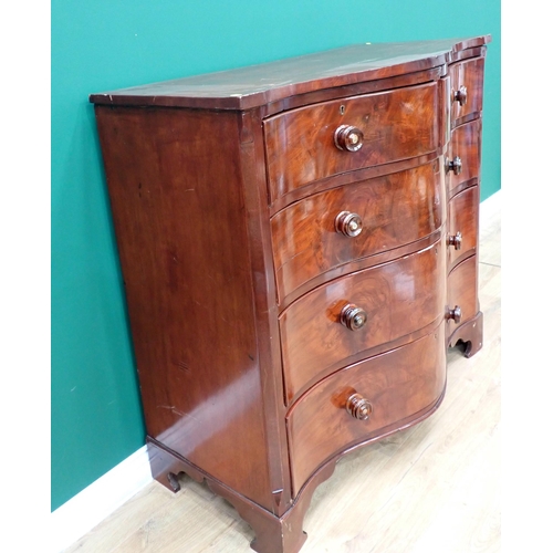 69 - A 19th Century serpentine fronted Chest of two short and three long drawers mounted on ogee bracket ... 