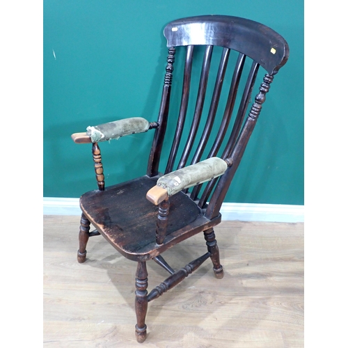 690 - A Windsor Elbow Chair with upholstered Arms