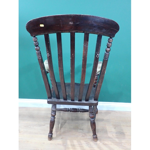 690 - A Windsor Elbow Chair with upholstered Arms