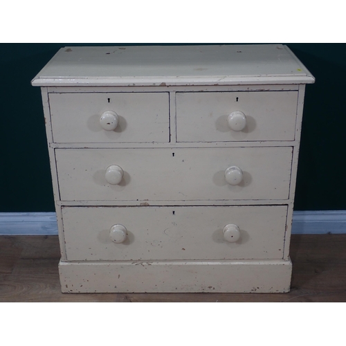 693 - A small white painted pine Chest of two short and two long drawers on plinth base, 2ft 10in W (two h... 