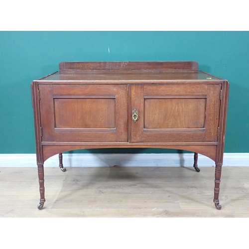 694 - A stained wood Dressing Table with pair of cupboard doors on turned supports, 3ft 5in W