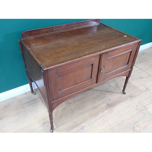 694 - A stained wood Dressing Table with pair of cupboard doors on turned supports, 3ft 5in W