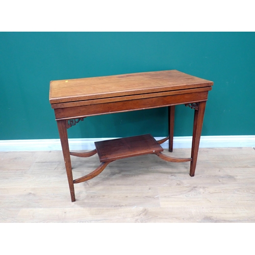 70 - A mahogany fold over Card Table on square cut tapering supports 2ft 11in W x 2ft 3in H