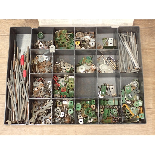 704 - A plastic case and filing drawers containing a quantity of Meccano pieces