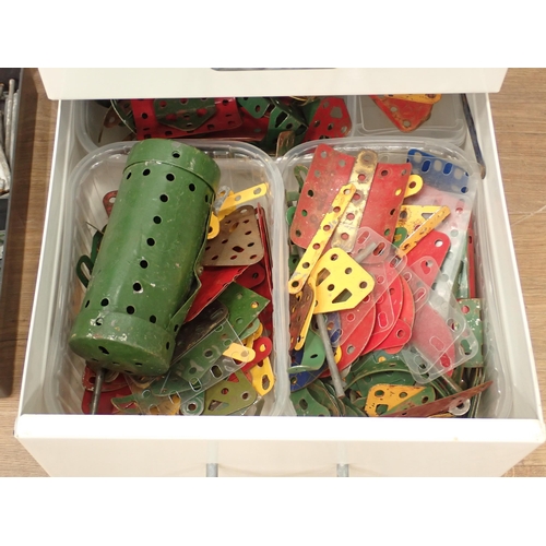 704 - A plastic case and filing drawers containing a quantity of Meccano pieces