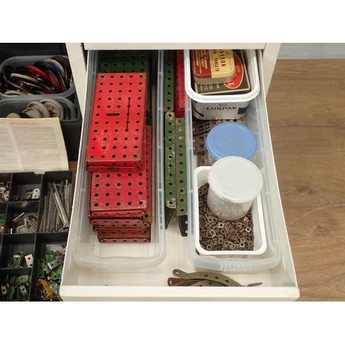 704 - A plastic case and filing drawers containing a quantity of Meccano pieces