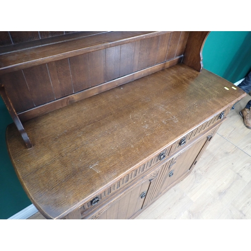 717A - An oak dresser with rack fitted drawers and cupboards, 5ft 10in H x 4ft 2in W