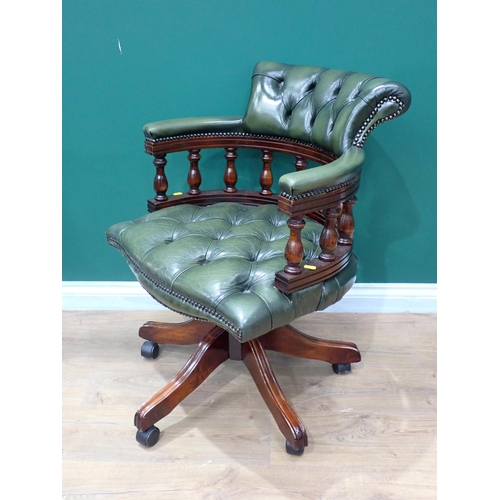 776 - A green leather covered swivel Office Chair