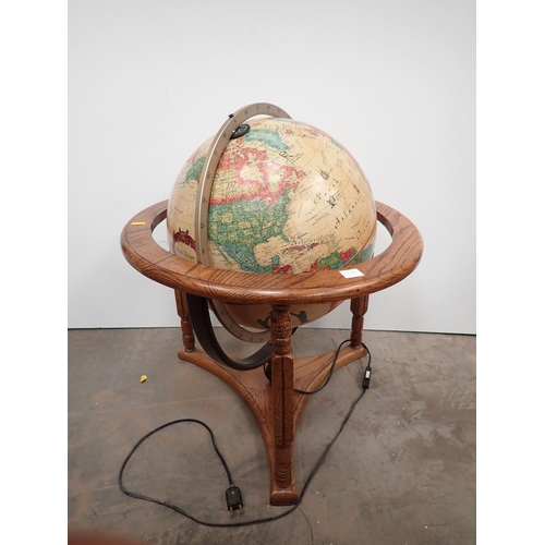 79 - A modern Globe on oak veneered stand A/F, failed PAT